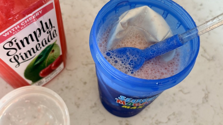 An open Slushy Magic Max cup after shaking