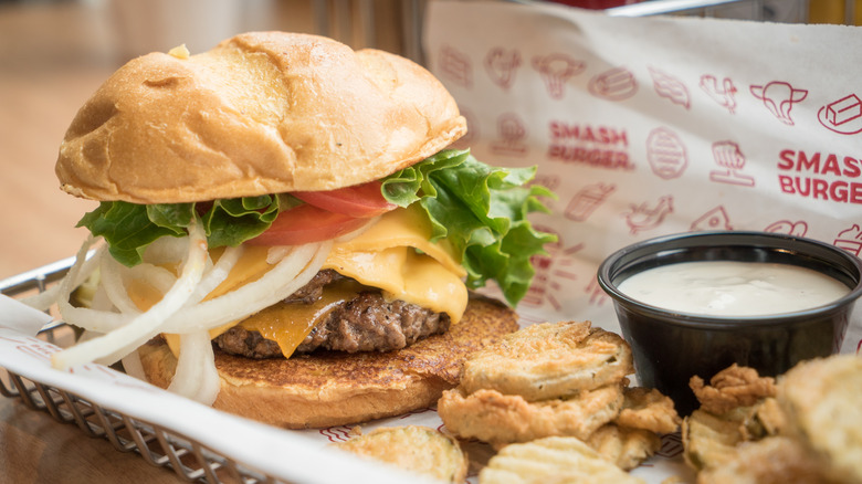 Smashburger burger and fried pickles