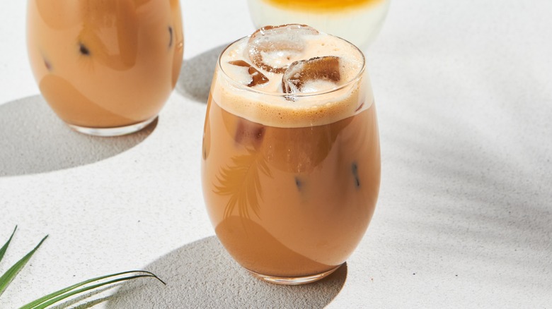Iced coffees on white background