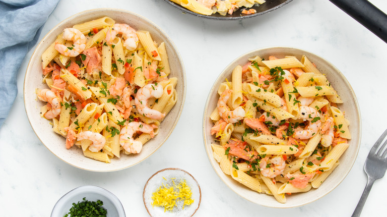 Smoked salmon and shrimp pasta in bowls