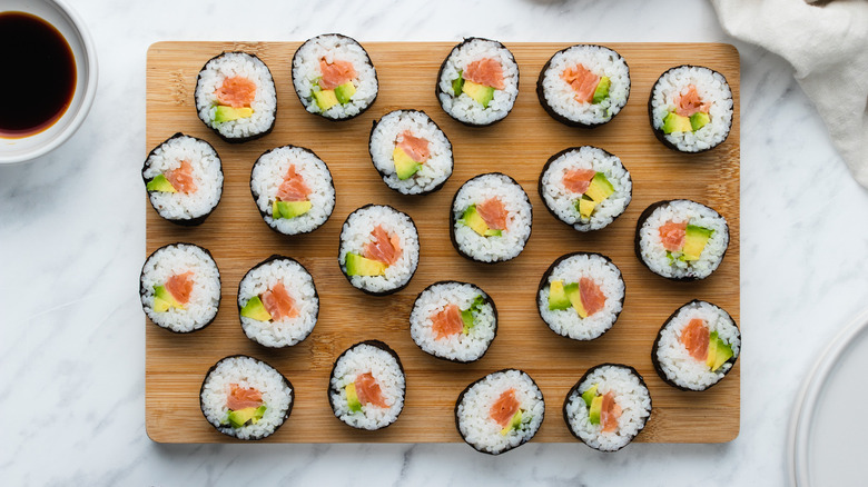 smoked salmon sushi on board 