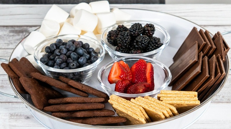 S'mores ingredients with fresh berries