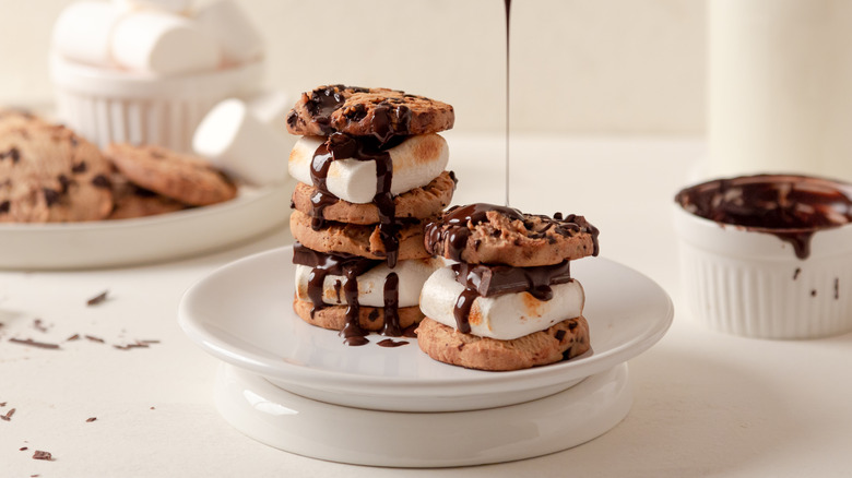 Chocolate drizzling over s'mores cookies