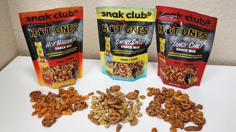 Snak Club Hot Ones Snack Mix bags and pieces
