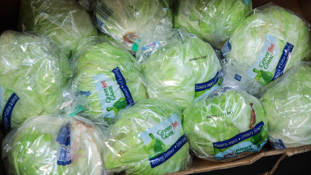 Box of iceberg lettuce at store