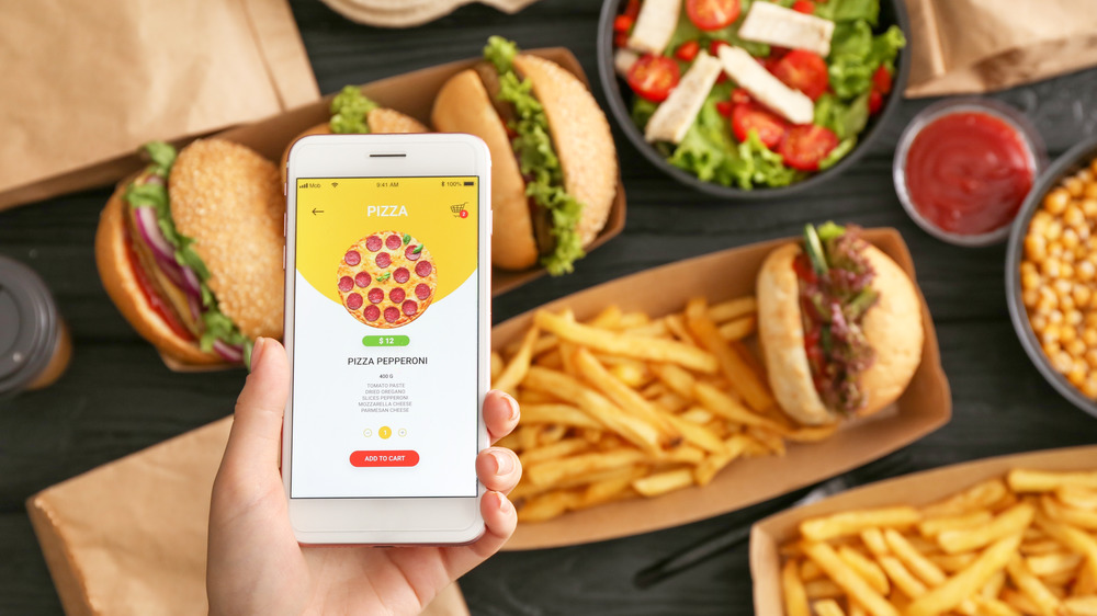 woman ordering pizza over salad