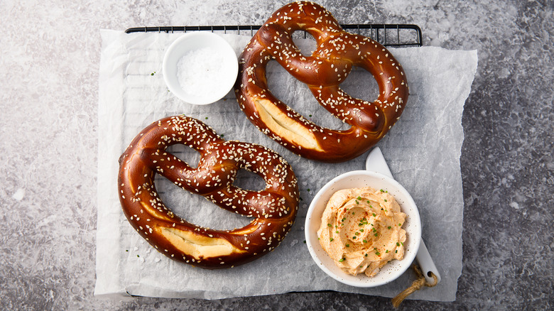 two pretzels with cheese dip