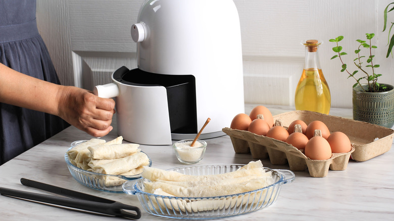 Air fryer on counter with food