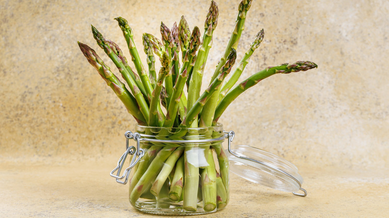 Asparagus soaking in a jar of water
