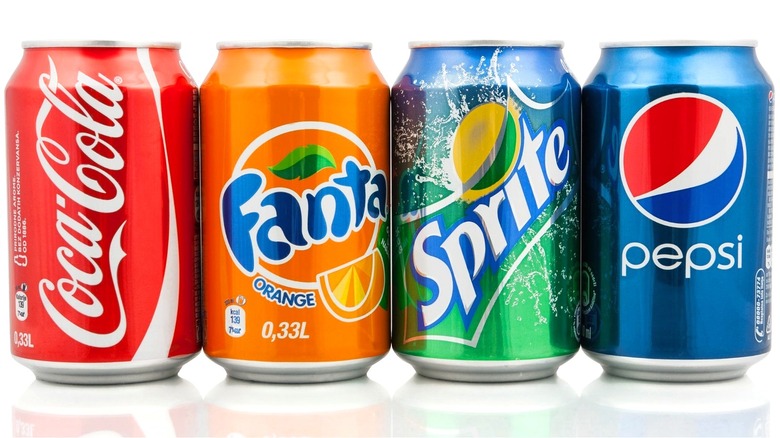 4 soft drink cans (Coca-cola, Fanta, Sprite, Pepsi)