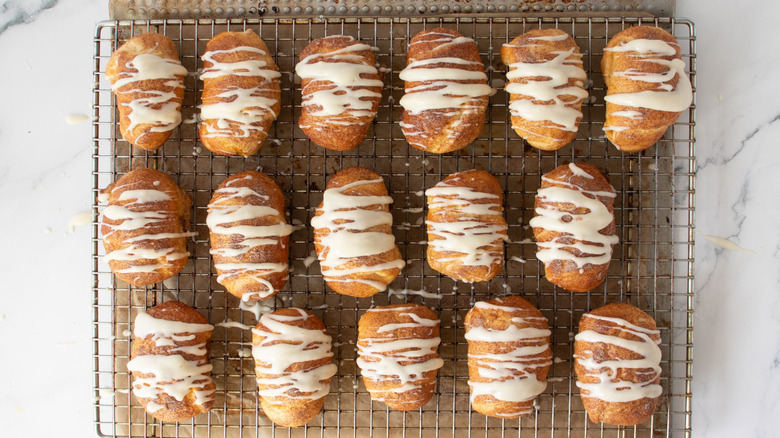 Glazed crescent rolls on wire rack