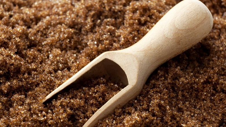 Wooden spoon in brown sugar 