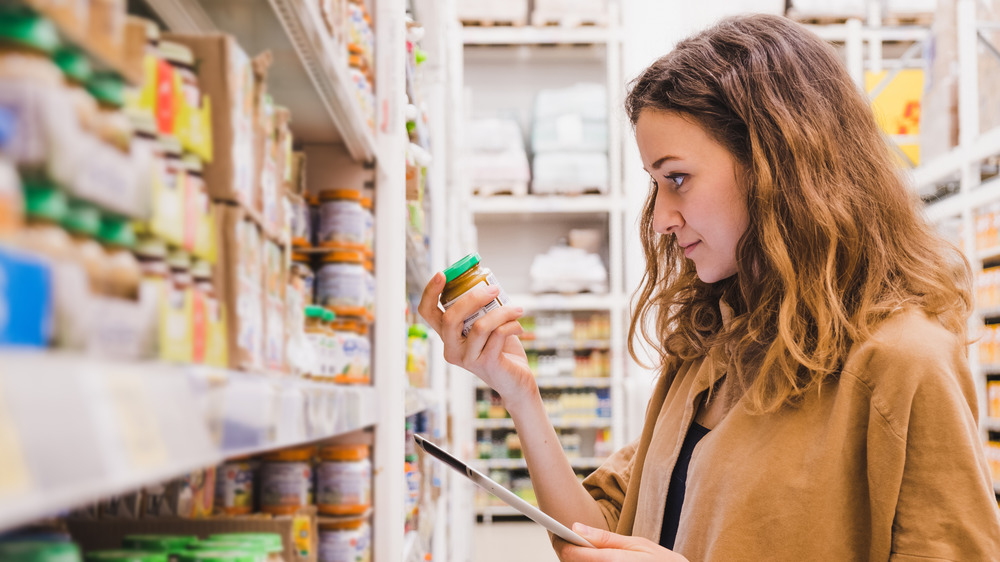 Woman shopping for baby food