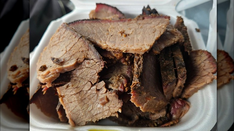 Buc-ee's chopped brisket by the pound in white styrofoam container.