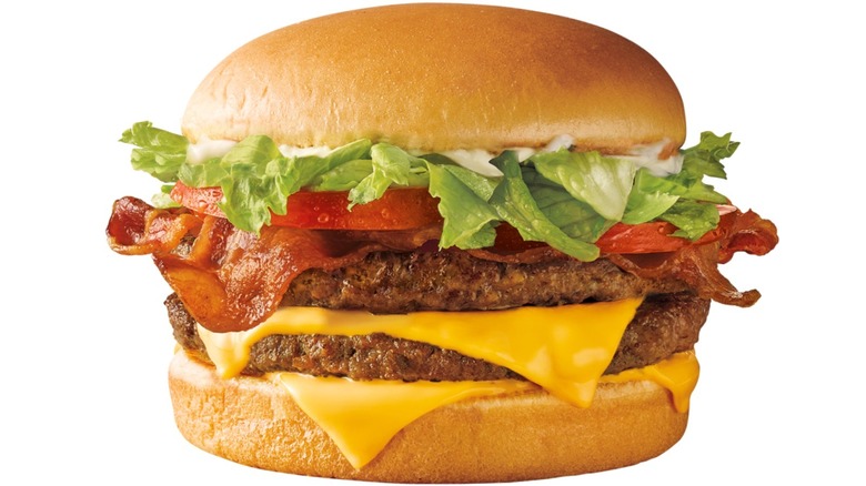 burger with two patties, bacon, cheese, lettuce, tomato