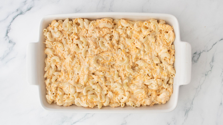 Unbaked mac and cheese in casserole dish