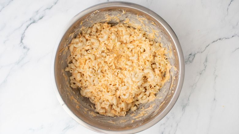 Unbaked mac and cheese mixture in bowl
