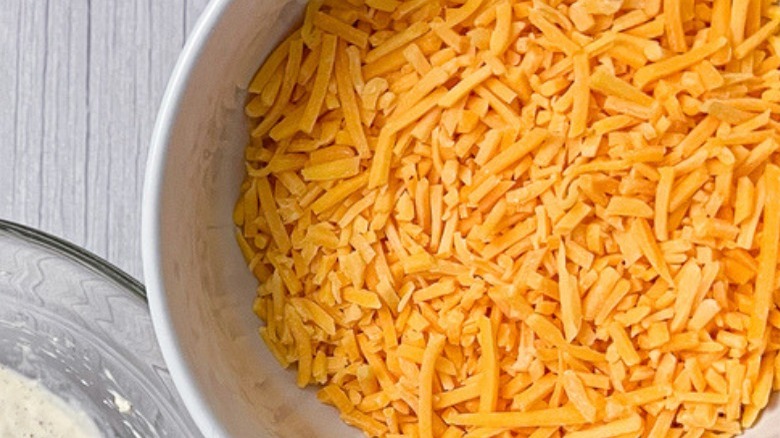 bowl of grated cheddar cheese