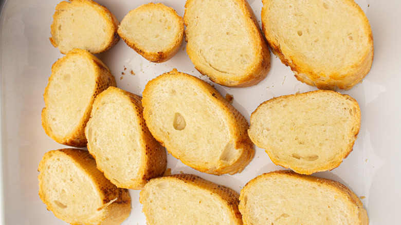 Sliced bread on baking sheet