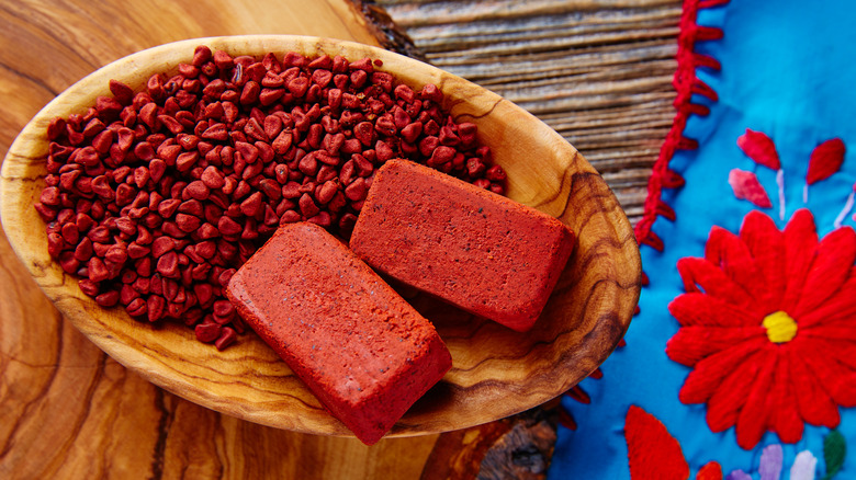 Annatto seeds and achiote paste in a bowl