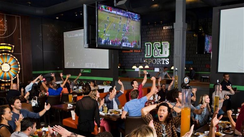 fans cheer sports at dave & buster's