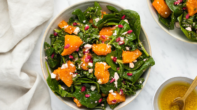 squash pomegranate salad in bowl 