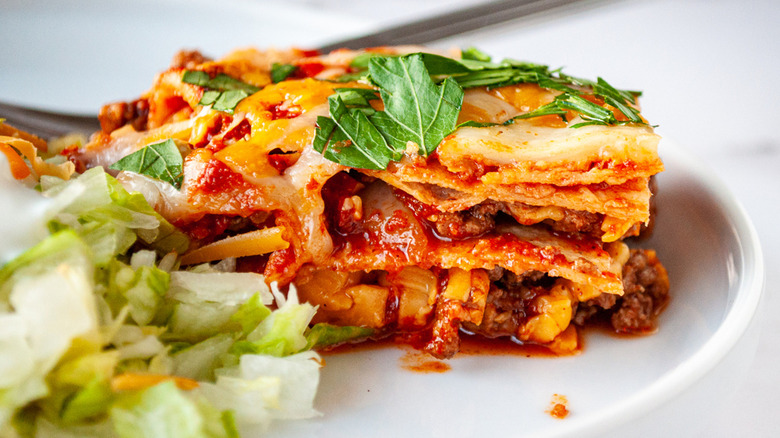 Enchilada casserole on white plate