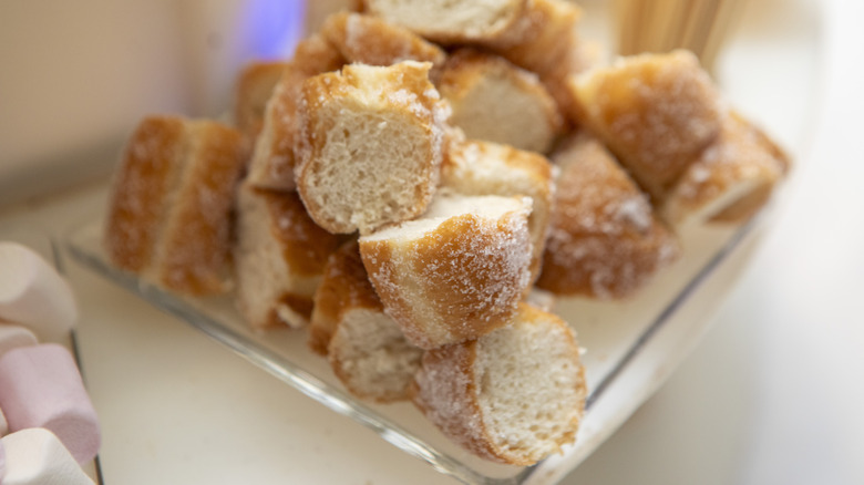 A dish of cubed donut pieces ready to become croutons