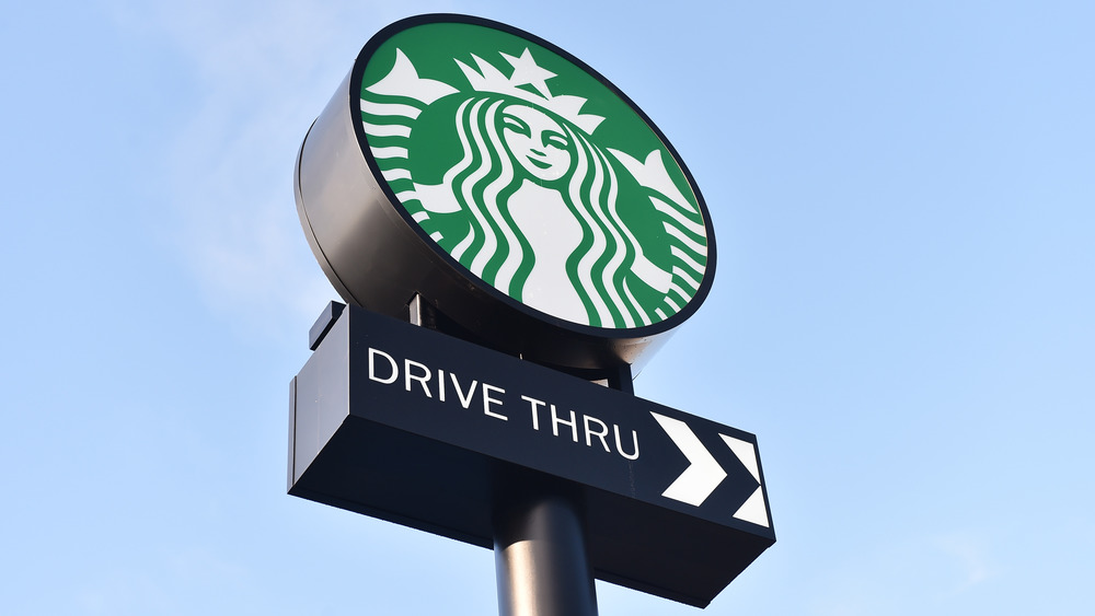 Starbucks sign against blue sky