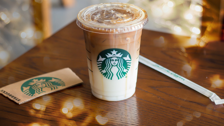 Starbucks iced coffee drink next to straw