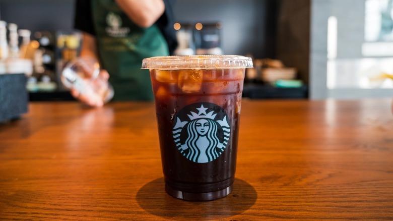 Starbucks iced coffee on barista counter