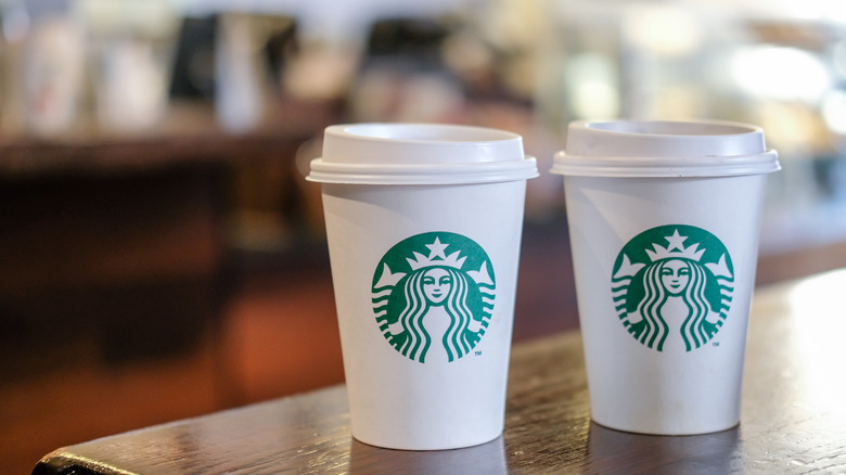 two starbucks coffee cups