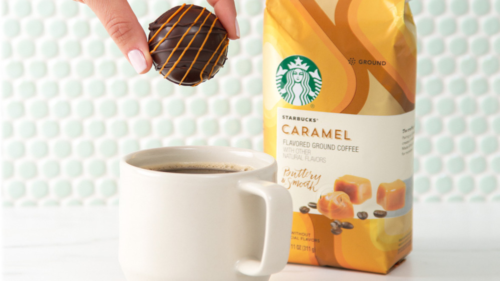 Coffee bomb being dropped into mug