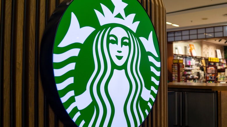 Large Starbucks logo sign outside of store