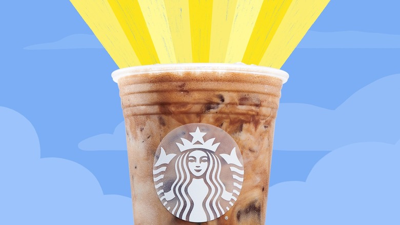 golden light coming out of a Starbucks iced coffee or cold brew cup