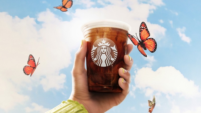 butterflies surrounding Starbucks iced coffee