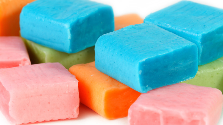 Blue, green, pink, and orange candy squares