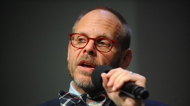 alton brown speaking into microphone