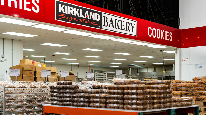 A Costco Kirkland Signature bakery department with stacks of muffins and baked goods