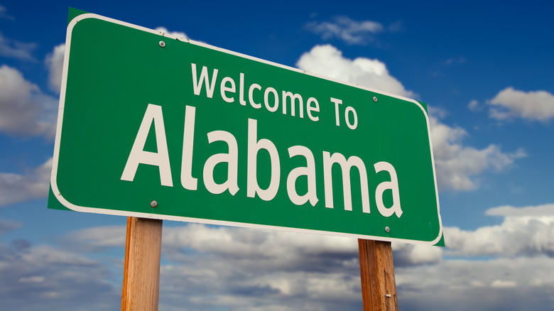 Welcome to Alabama sign with cloudy sky