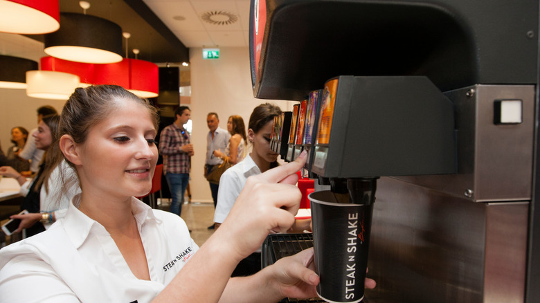 SteakNShake employee at soda machine 