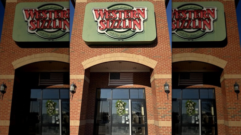 Western Sizzlin sign on brick building