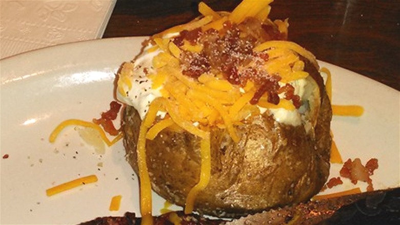 Loaded baked potato on plate