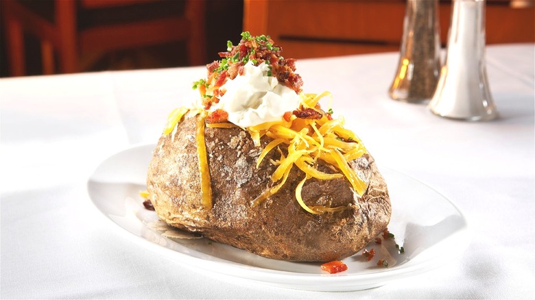 Loaded baked potato on plate