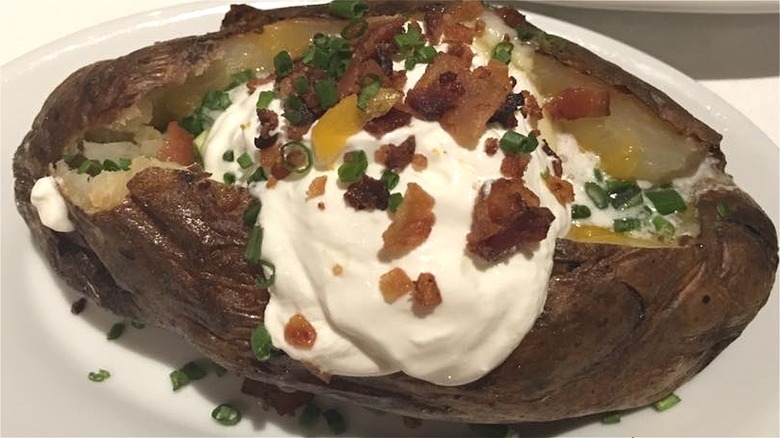 Loaded baked potato on plate