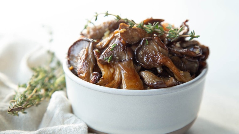 sauteed mushrooms in white bowl