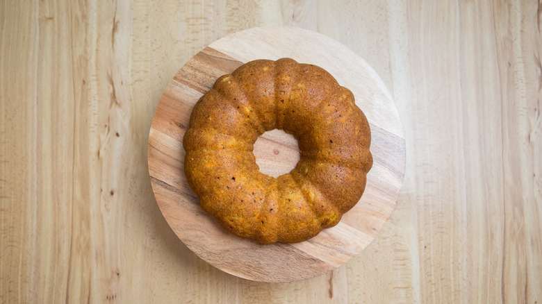 bundt cake on wooden stand