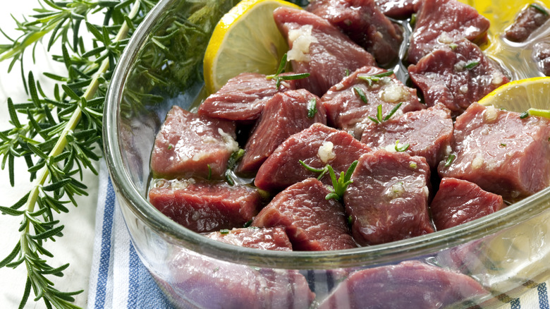 Meat marinating in a bowl