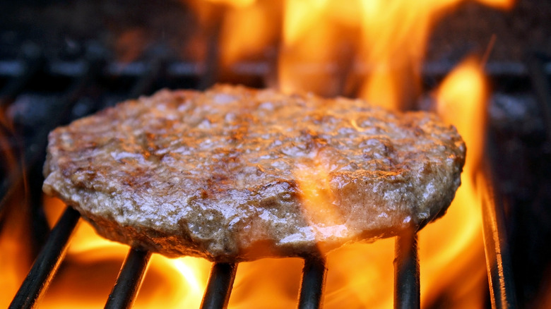 Burger over flames