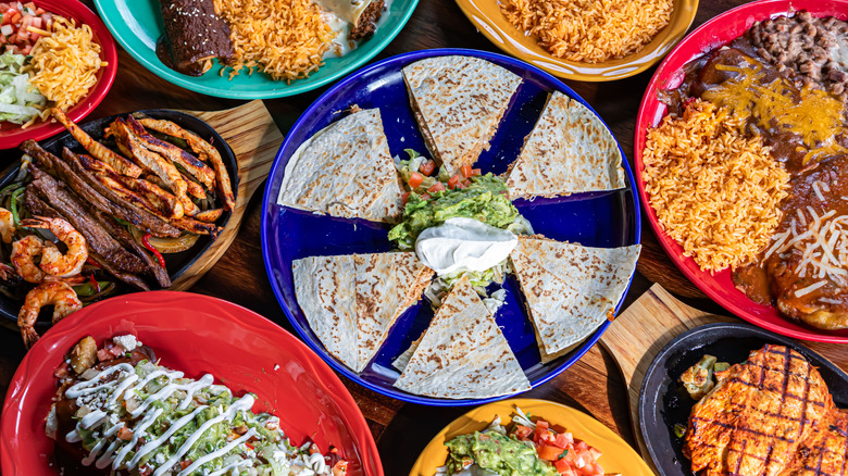 Various Mexican dishes on table